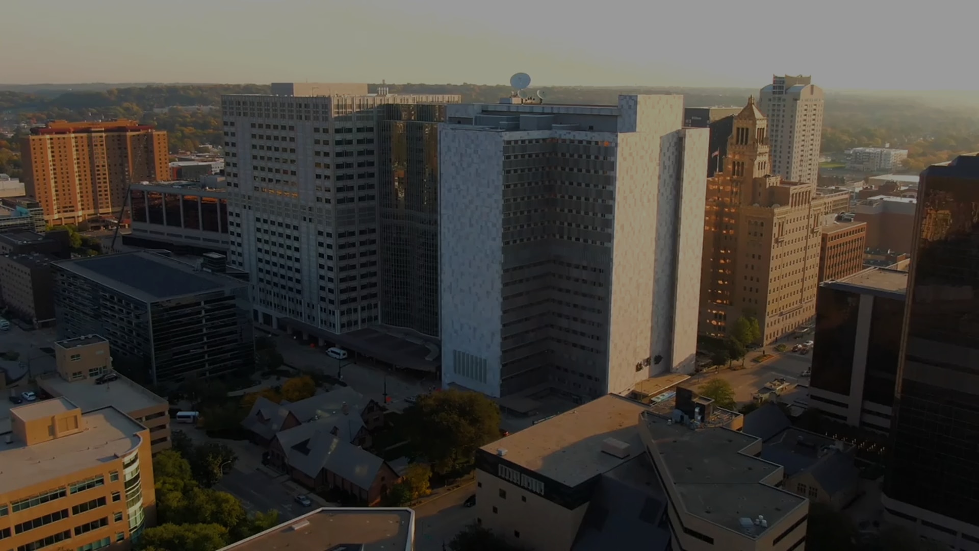 Drone footage sweeping over Mayo Clinic’s downtown Rochester campus during sunrise, emphasizing the size and modern architecture of the facility.
