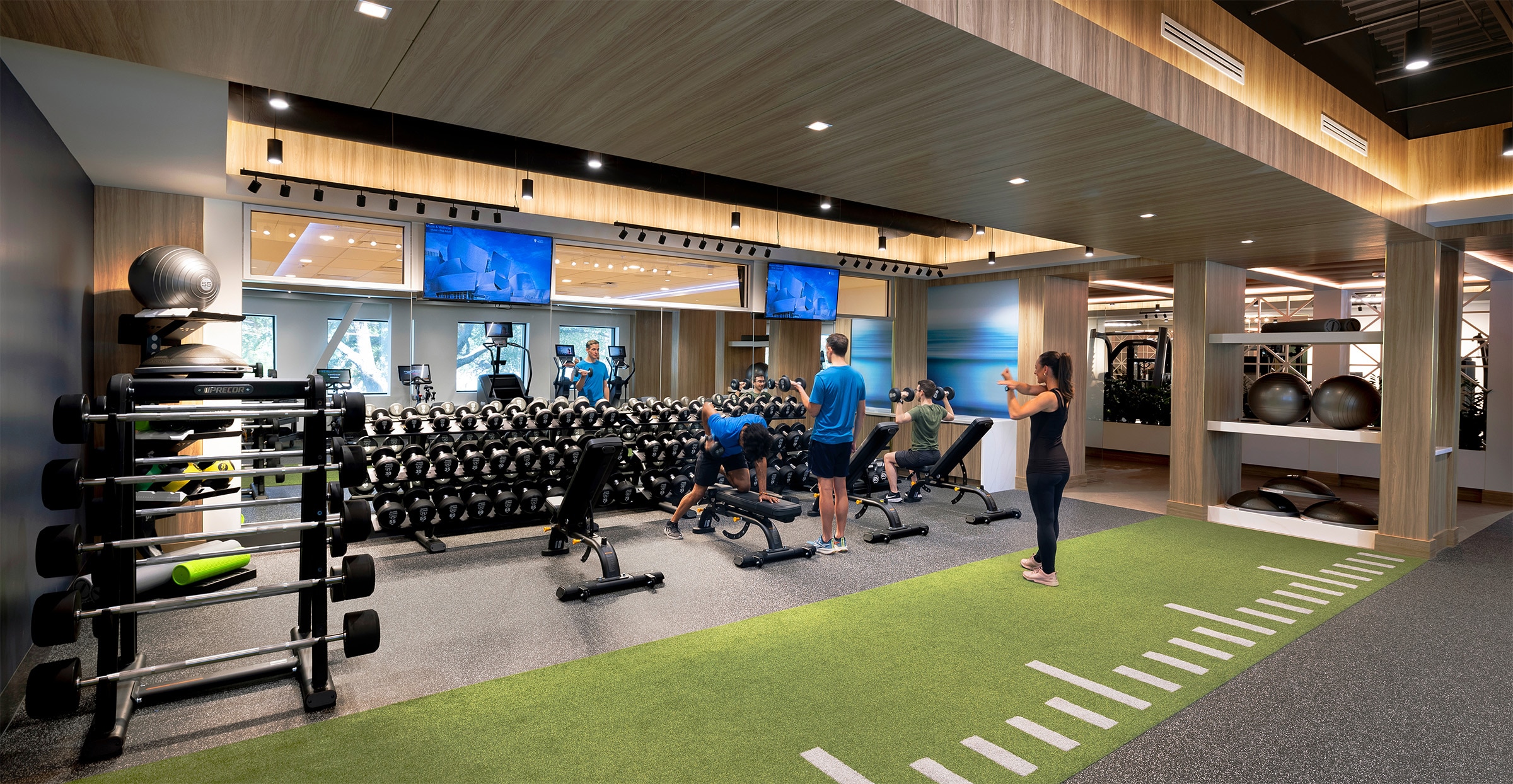 Four individuals using Mayo Clinic training facilities.