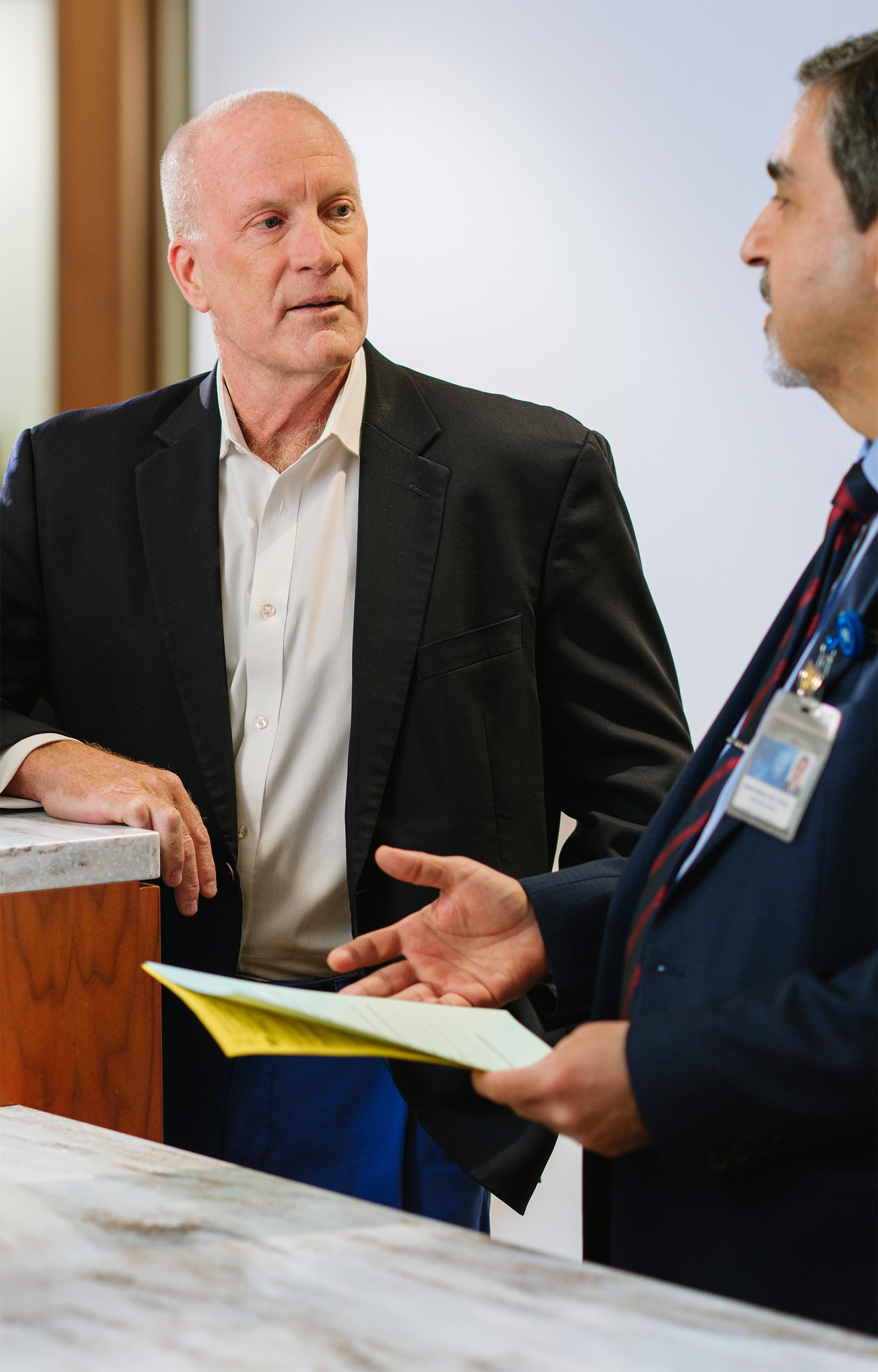Mayo Clinic physician speaking with a patient in a bright, modern consultation room.