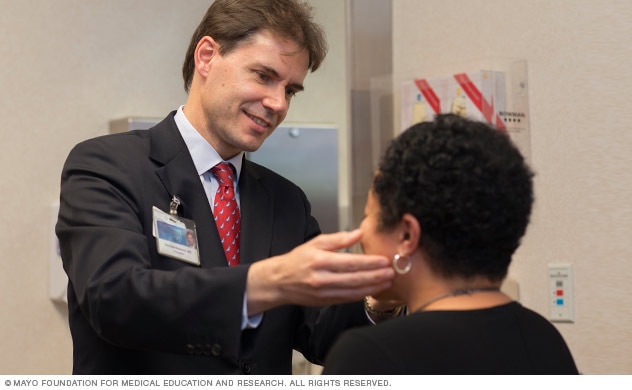 Doctor examines hepatitis C patient.