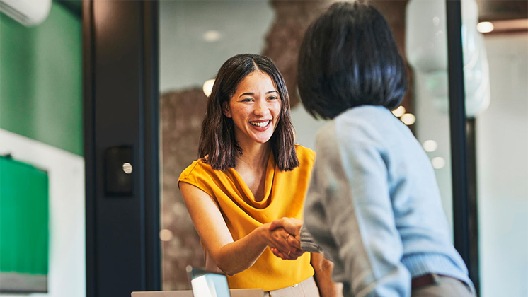Representative welcoming a guest to a professional consultation.
