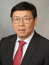 Head and shoulders photograph of Eric Chen, M.D., Ph.D.